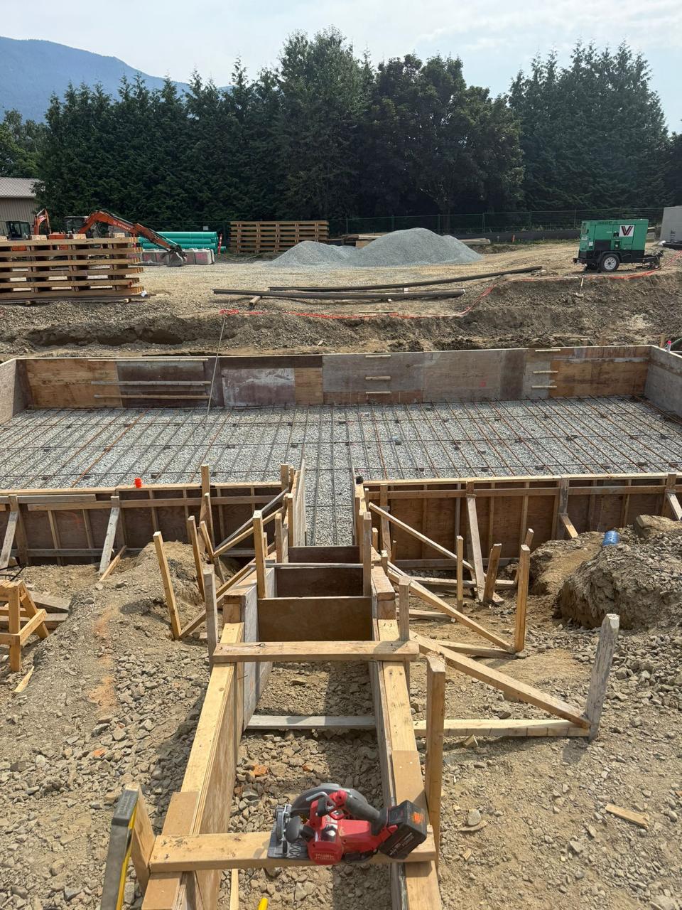 Large-scale concrete wall forming in an open construction site